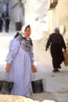 hard working Palestinian women. Palestinian women working in construction in a refigee camp